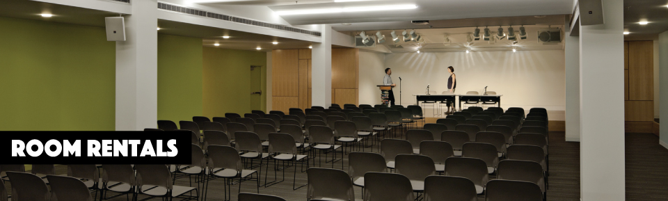 a sample of a space available for rent at Portland Public Library with many chairs distributed in the room