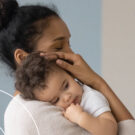 A mother holds her new newborn